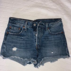 Slightly distressed woman’s Levi’s shorts
